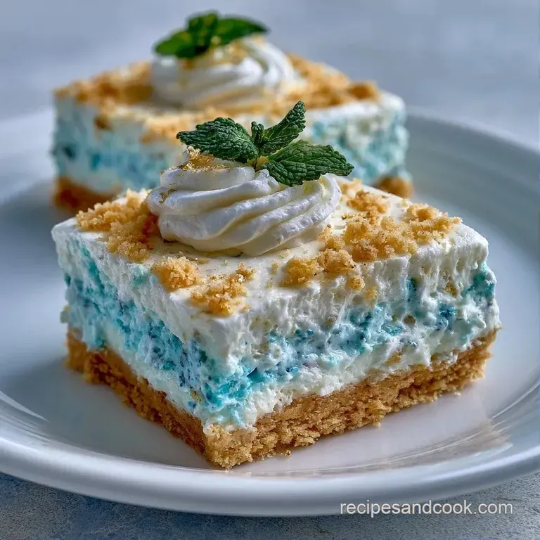Square slices of vibrant blue cake topped with velvet white icing, arranged on a minimalist white ceramic platter.